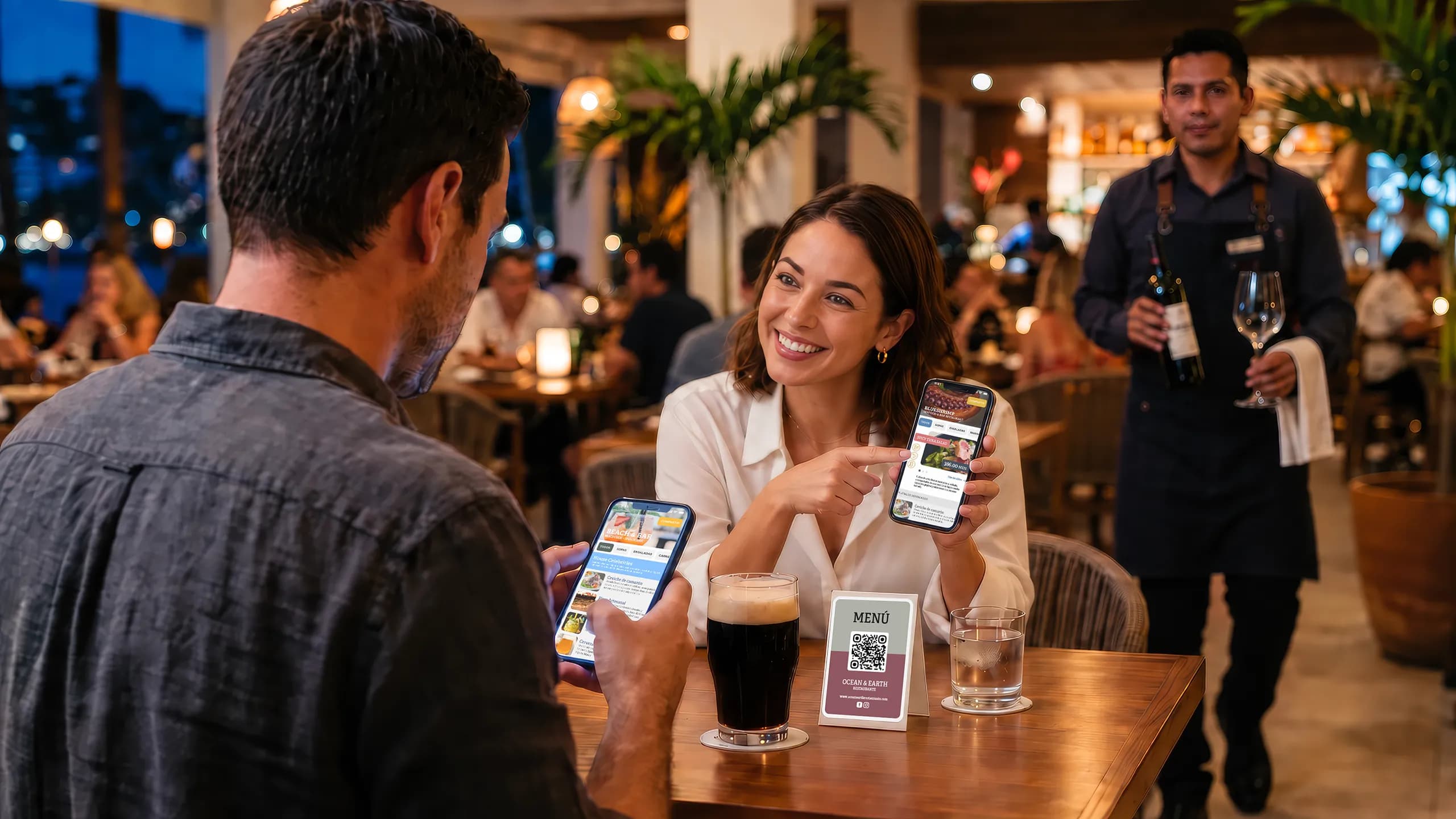 Guests exploring a GETSOMMM digital menu together while a waiter approaches with wine
